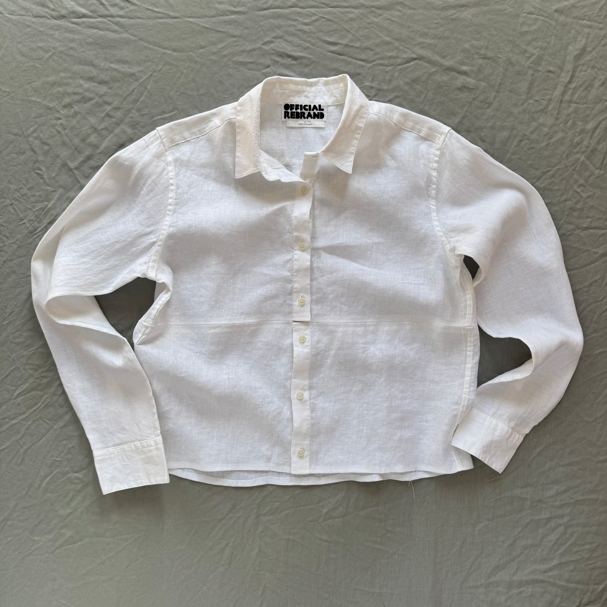 white linen shirt on gray backdrop