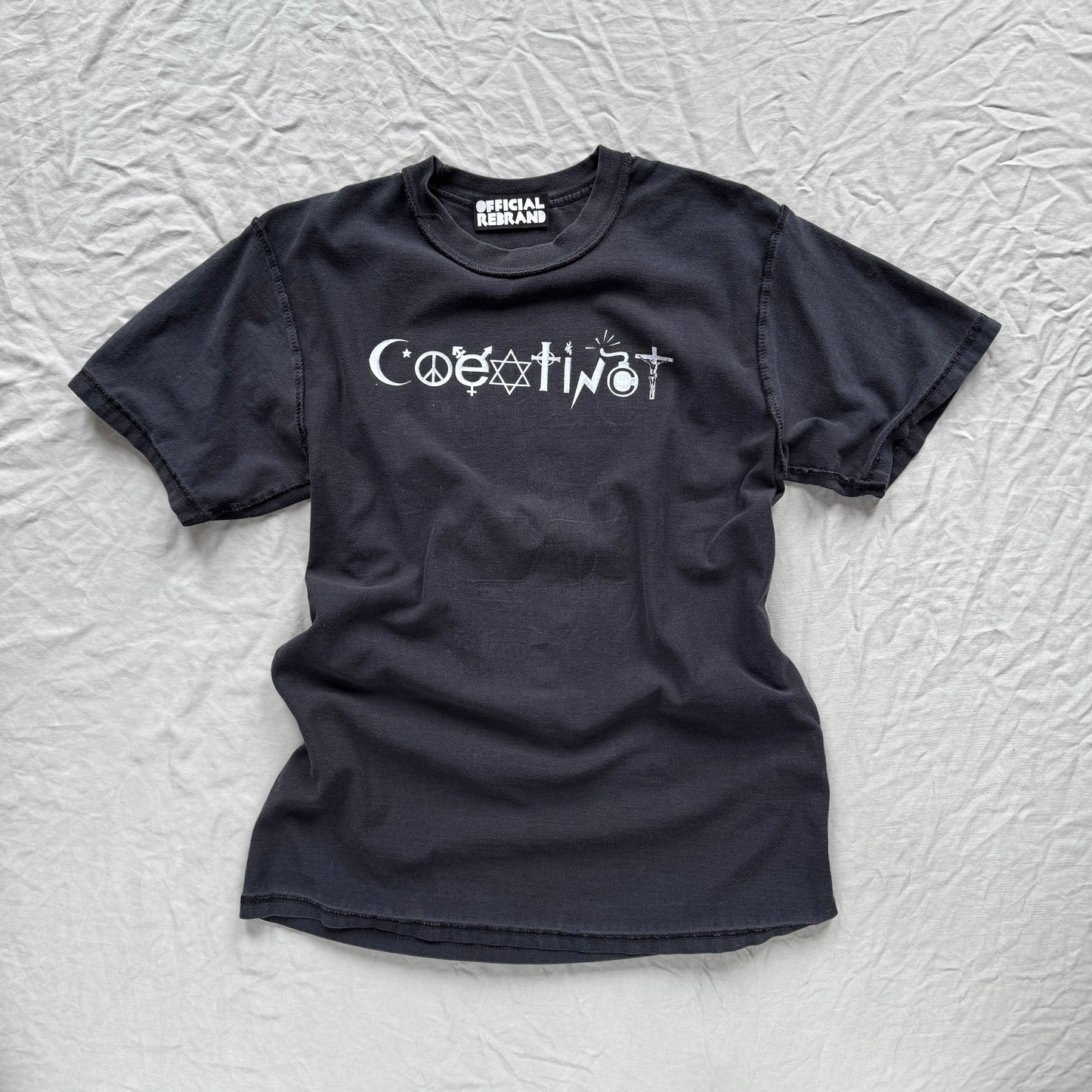 COEXTINCT white on black pieces