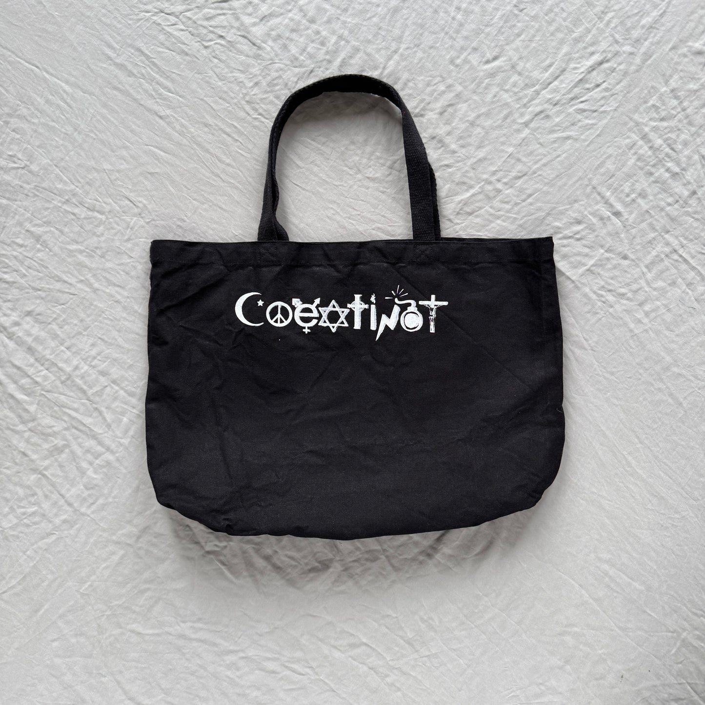 COEXTINCT white on black pieces