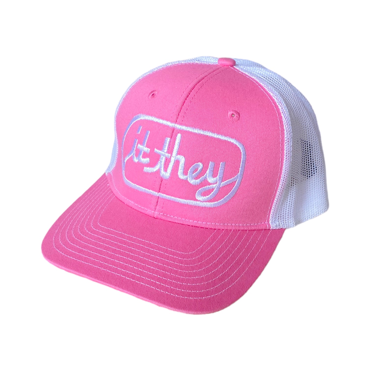 pink and white trucker hat with white embroidery reading it they in cursive