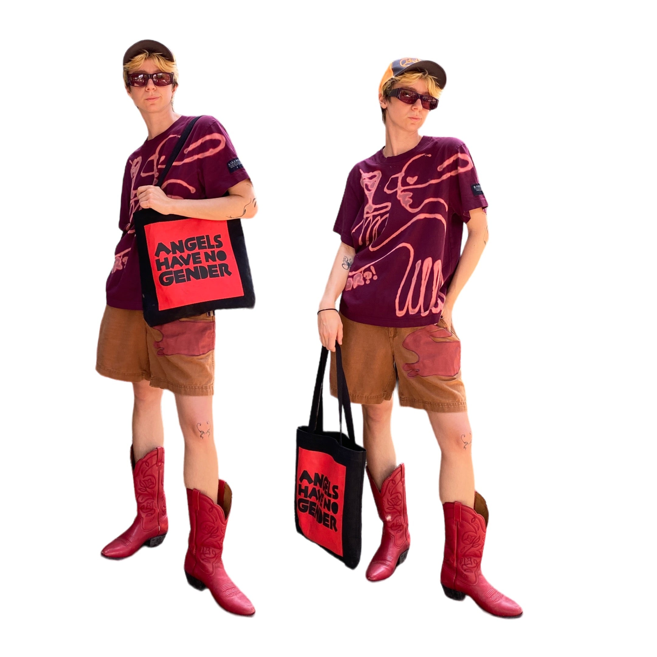 Model holding black tote bag with red screen printed box containing black text reading angels have no gender