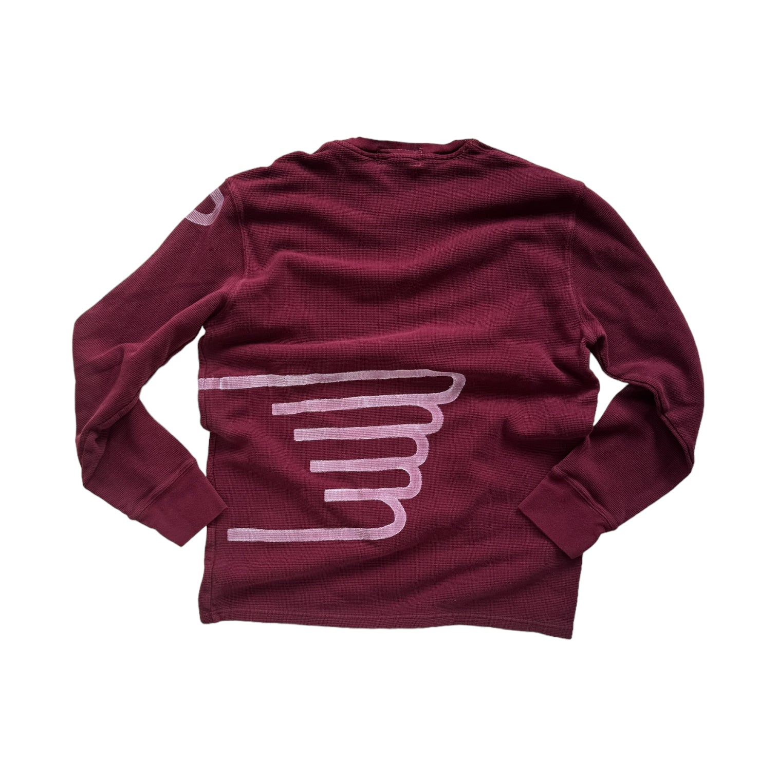 back of maroon red waffle shirt with white hand-painted angel wing across the lower back