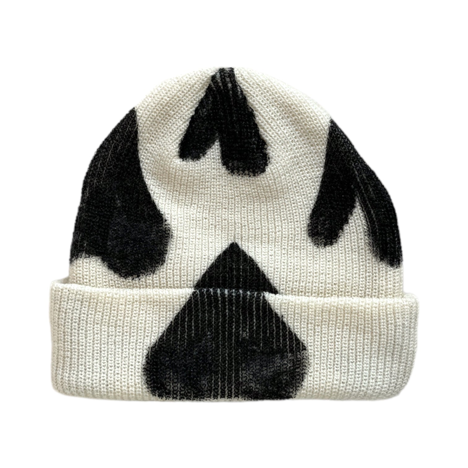 back of cream beanie with black hand painted hearts 