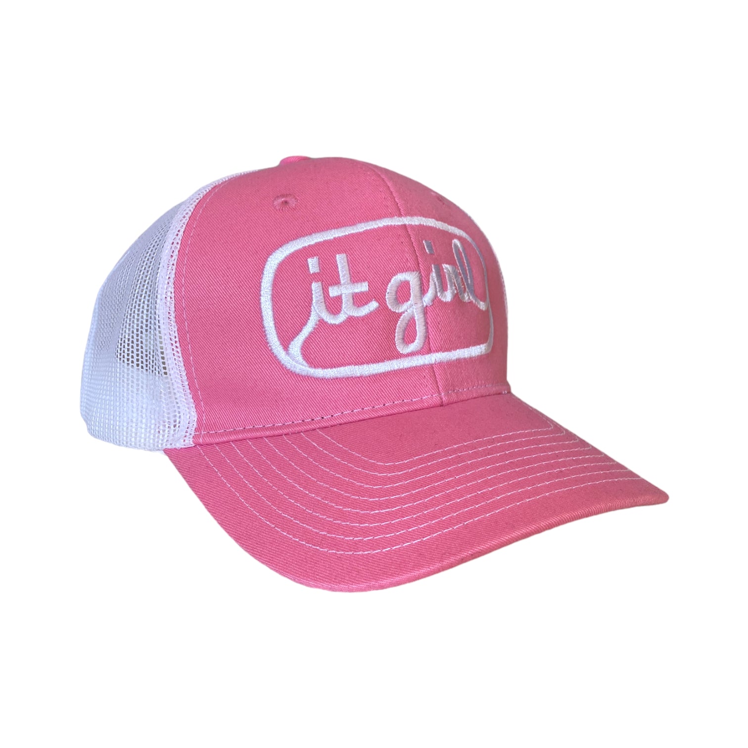 pink and white trucker hat with white embroidery reading it girl in cursive