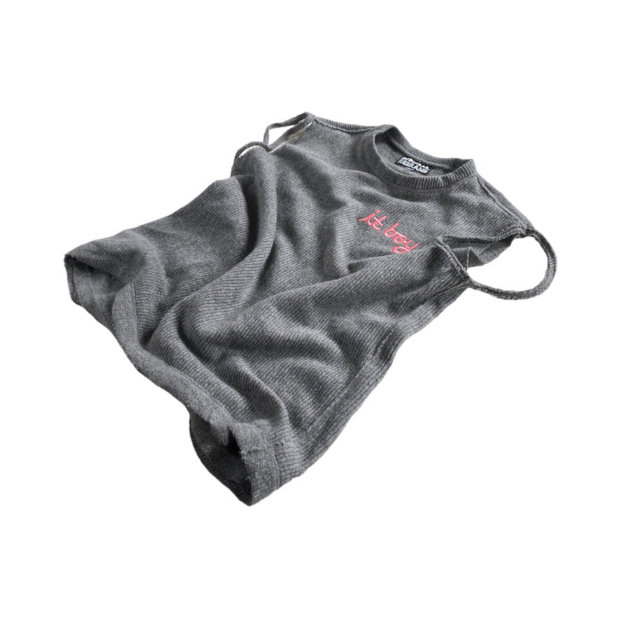gray knit sweater vest with slits around the arm holes and pink cursive embroidery on the chest reading it boy