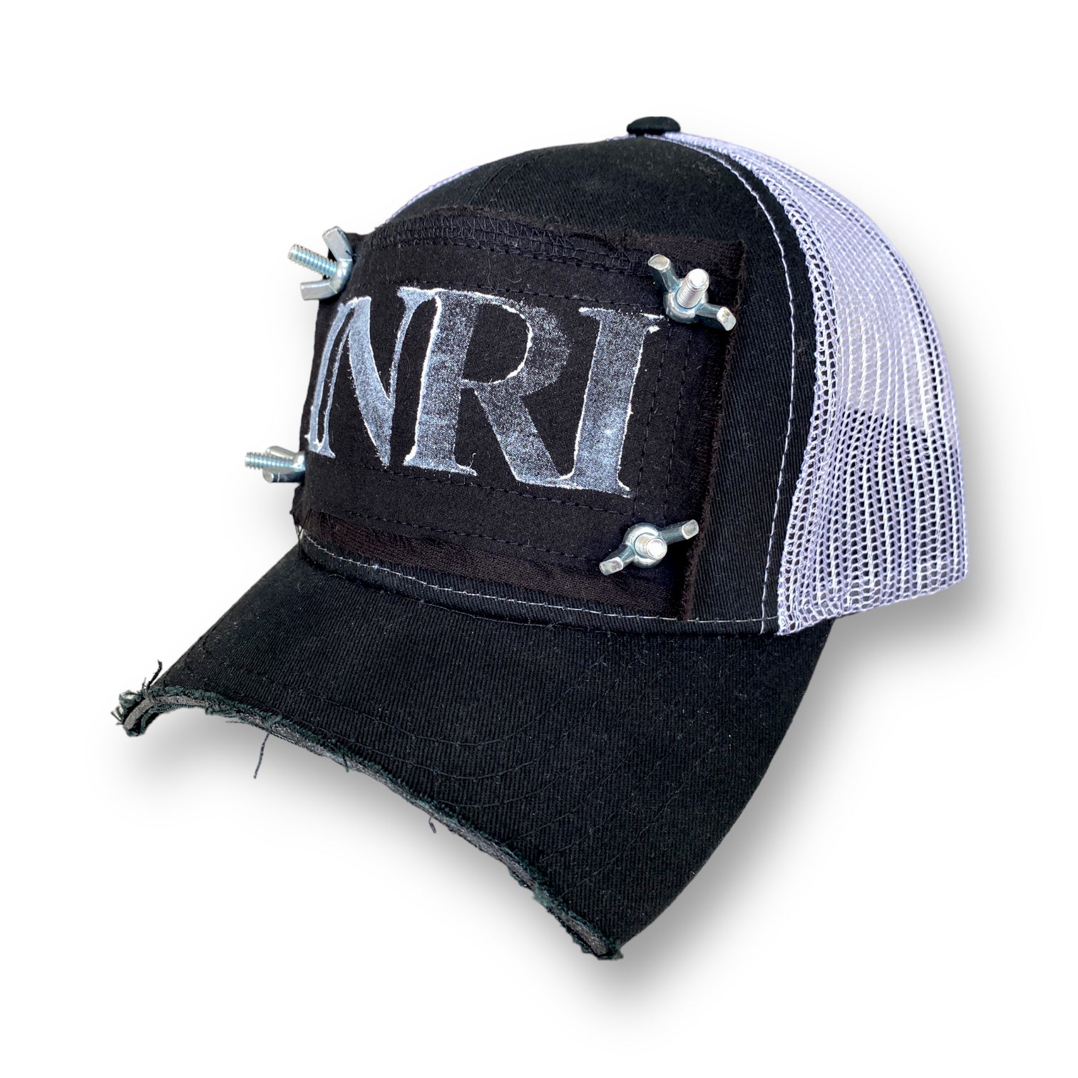 chopped brim trucker hat with white mesh back, black patch with white INRI stamp, and nuts and bolts affixing the four corners of the patch to the front of the hat