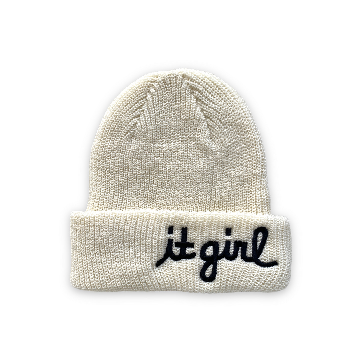 white cream wool beanie with black cursive embroidery reading it girl