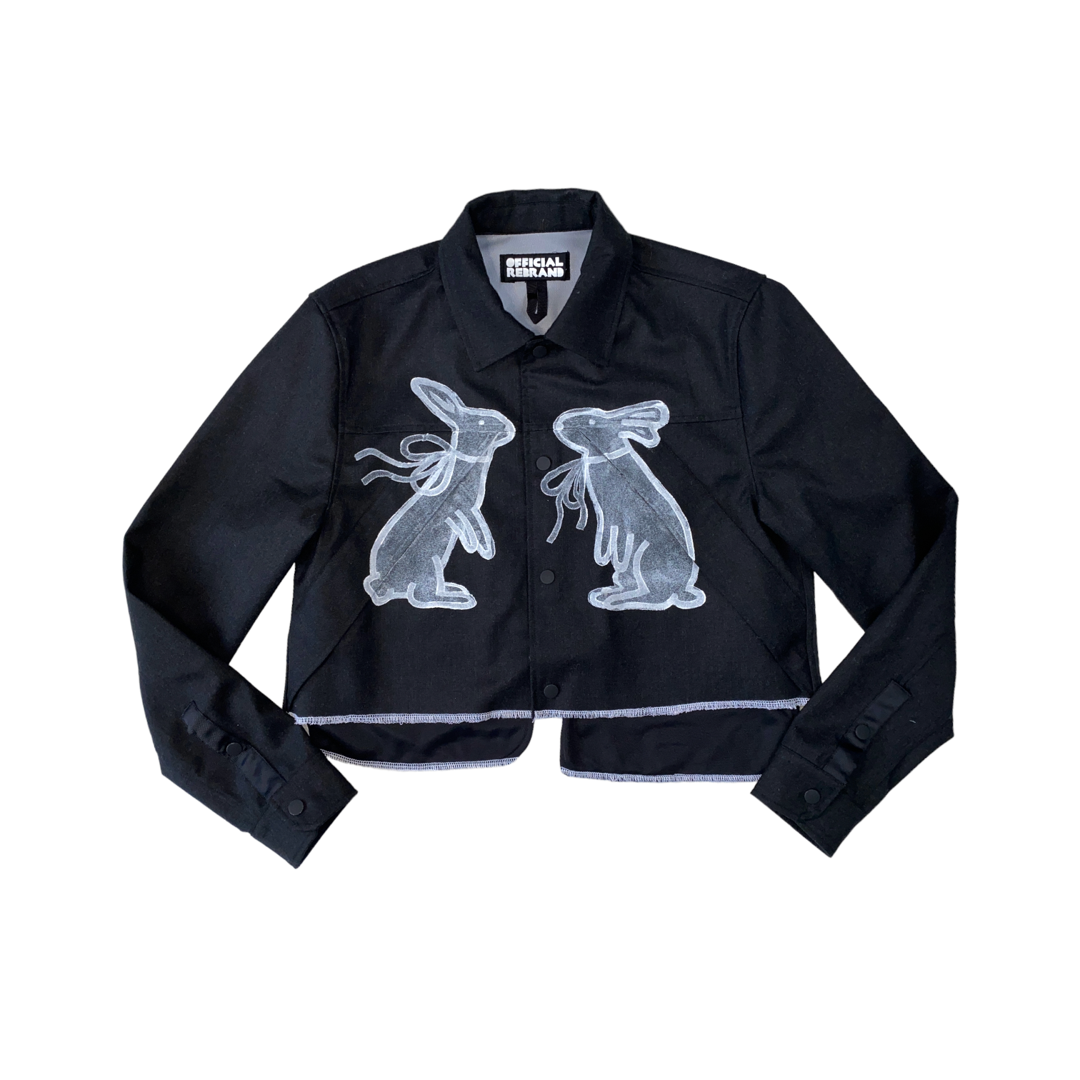 white edged cropped black wool jacket hand-painted with two white rabbits with bows facing each other on the front