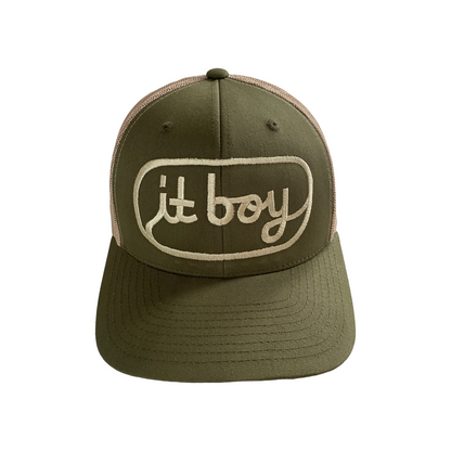 front of olive green and beige khaki trucker hat with khaki embroidery reading it boy in cursive