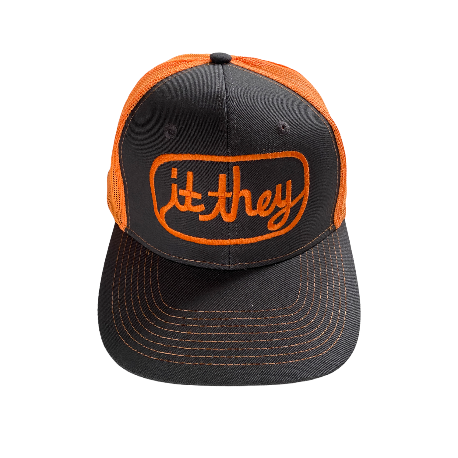 front of neon orange and stone gray trucker hat with orange embroidery reading it they in cursive