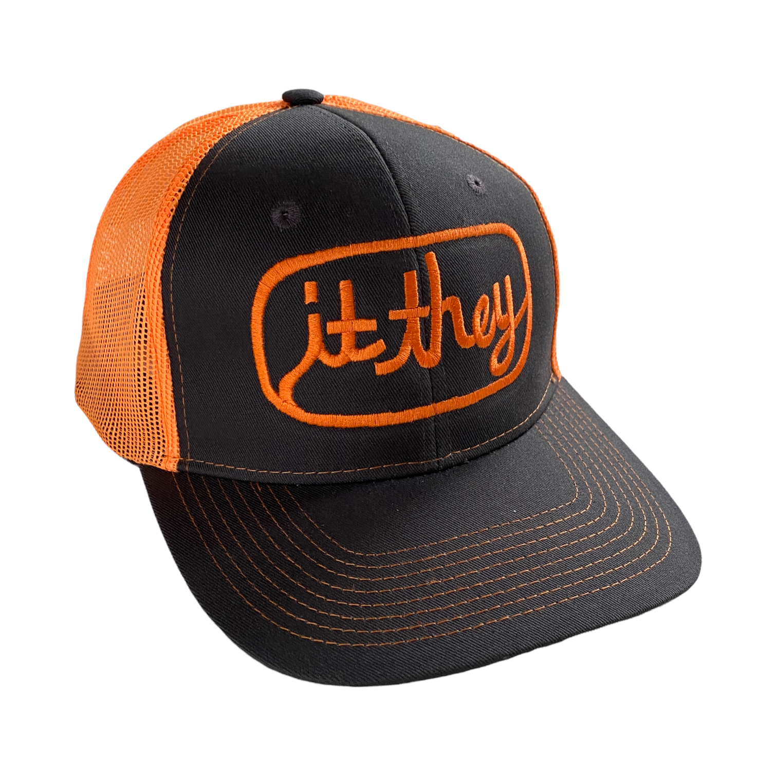 neon orange and stone gray trucker hat with orange embroidery reading it they in cursive